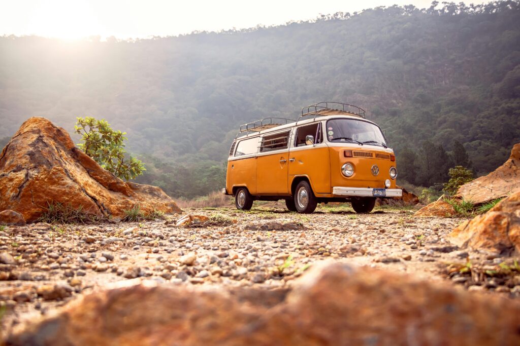 pexels-photo-2533092-2533092 Classic VW van parked on rocky terrain with mountains in Alegría, El Salvador.