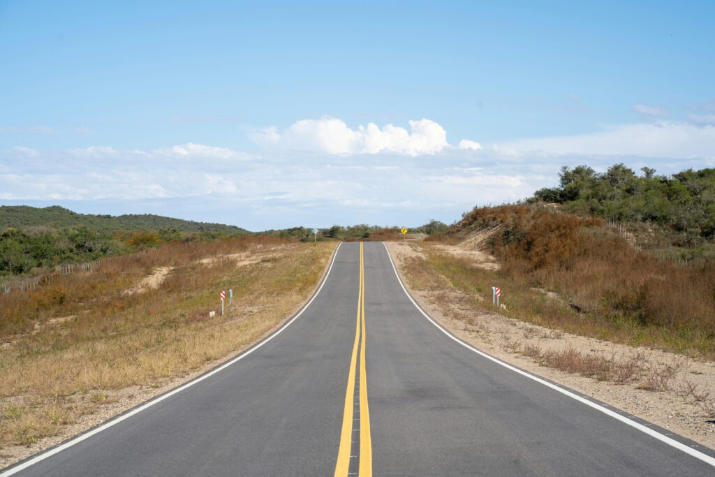 pexels-photo-31905151-31905151 A peaceful road through Río de los Sauces, Córdoba, on a clear day.